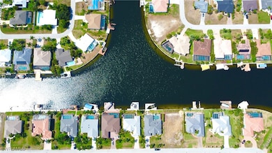 Drone / aerial view with a water view and a reside