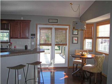 The dining area also has wood floors. The doors le