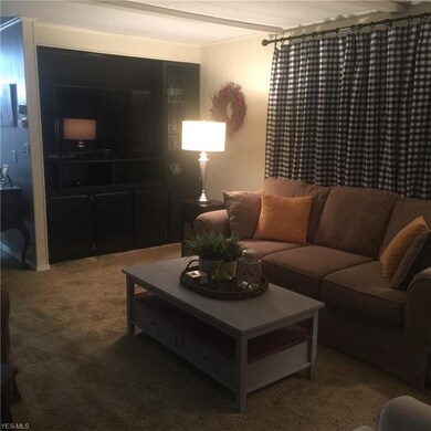 Gracious Living Room showing Built-in spot for TV 
