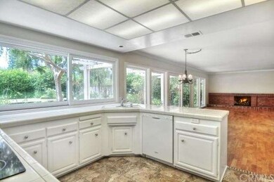 Kitchen looking into the family room and out to th
