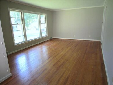 Spacious living room with new, neutral paint!