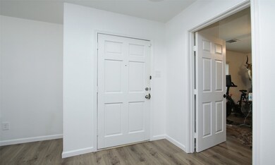 Welcome inside! A glimpse of the inviting entryway looking towards the front door.