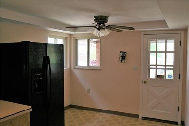 Very spacious kitchen with door to the covered por