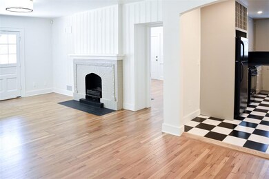 Unfurnished living room featuring a fireplace and 