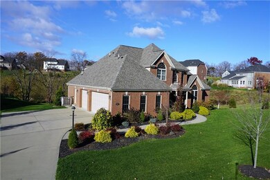 Custom brick home with a 3 car attached garage on 