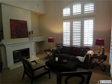 Living Room with Plantation Shutters and Fireplace