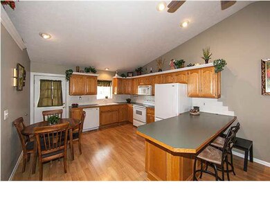Fully appliance kitchen with eating space and wood
