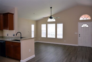 Triple window wall in the living area with palladi