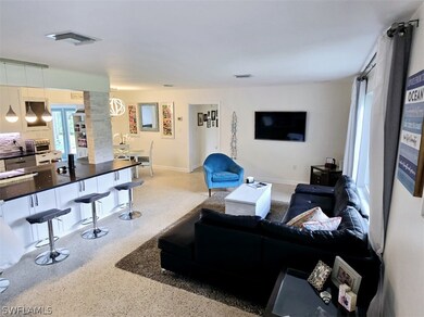 Living room featuring decorative columns