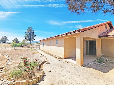 View of side of property featuring stucco siding,
