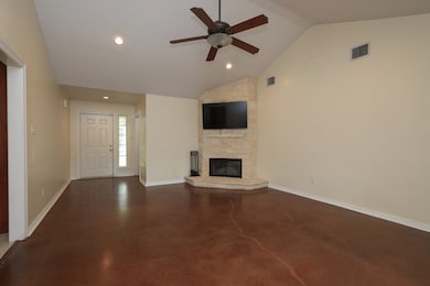 This spacious living room features a vaulted ceili