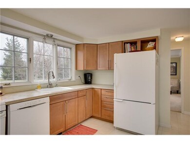 Kitchen. Large Picture window with Maple Cabinets and plenty of counter space.