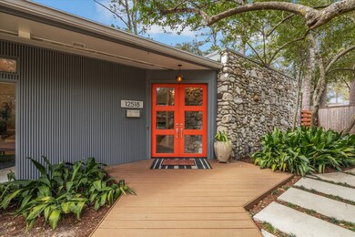 Vibrant orange front doors welcome you inside