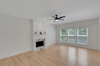 Unfurnished living room with light wood-style floo
