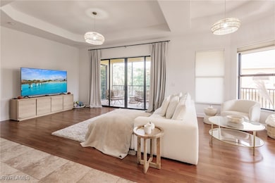 Family room featuring wood-type flooring, a trey c