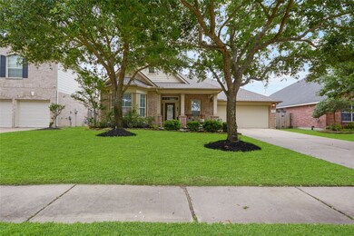 This home has the WOW Factor!  Check out the curb appeal with the beautiful landscaping and wonderful front porch.