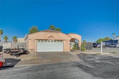 Mediterranean / spanish house with stucco siding, concrete driveway, and an attached garage