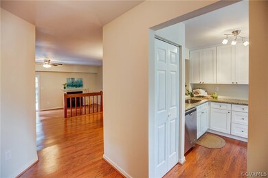 As you enter the front door, the kitchen is to you