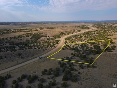 Aerial view of sparsely populated area featuring property parcel outlined