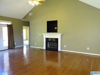 With soaring ceilings, fireplace, nook for T.V> an