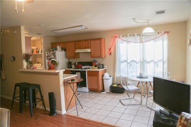 Kitchen with white appliances, under cabinet rang