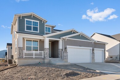 Craftsman inspired home featuring concrete driveway, stone siding, a garage, and a porch