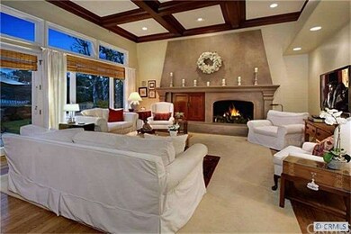 Dramatic family room with coffered ceiling detail.