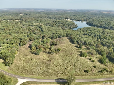 Aerial view of a large body of water and a heavily wooded area