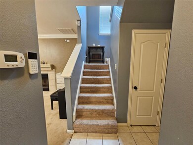 Staircase featuring light tile patterned flooring
