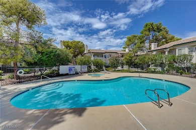 Community pool featuring a community hot tub and a