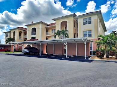 View of building exterior with covered parking