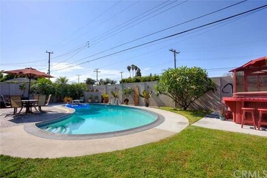 Large landscaped yard with grassy play area and be