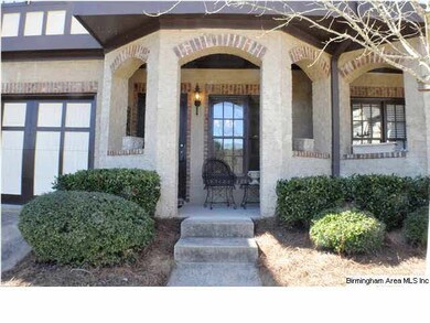 Lovely porch with glass pane front door and one ca