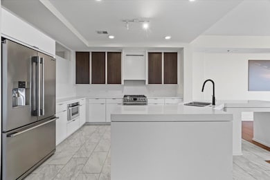 Kitchen with appliances with stainless steel finis