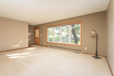 Step through the welcoming front entry to a spacious living room with big east facing window which floods this room with natural light. Good-sized entry closet.