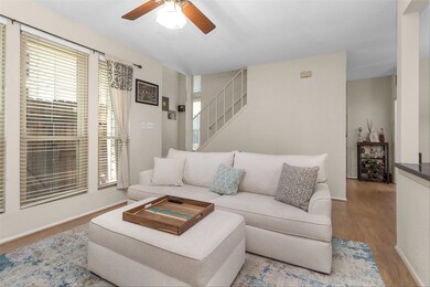 Overhead, a ceiling fan gently circulates the air,