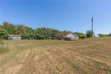 View of green lawn with a view of countryside