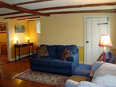 Living Room. Closet to the right under stairs to 2