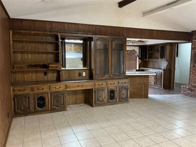 Kitchen with lofted ceiling with beams, dark brown