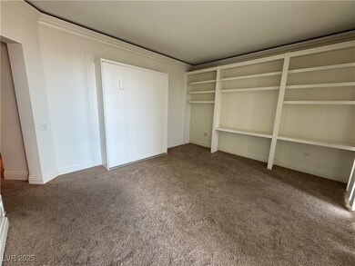 Unfurnished bedroom featuring baseboards, ornament