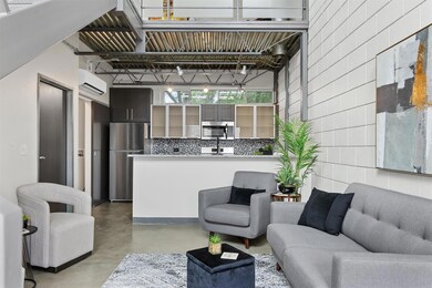 Living area featuring finished concrete floors an