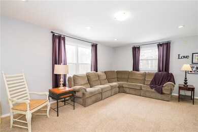 The living room opens to the large kitchen