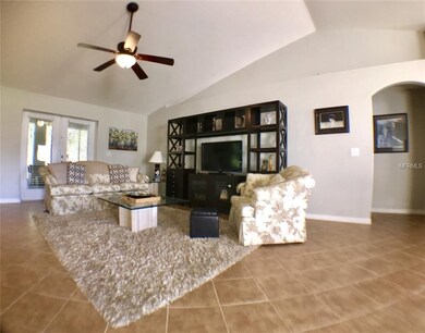 Great room with french doors to the lanai.
