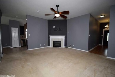Living room view, kitchen left, master right.