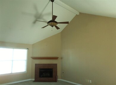 Vaulted Ceiling and Corner Gas Fireplace