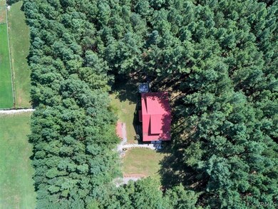 Situated on 5 acres, tucked back off the road.