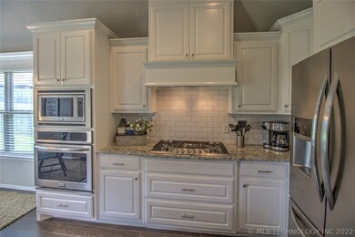 Built in stainless steel appliances with gas range