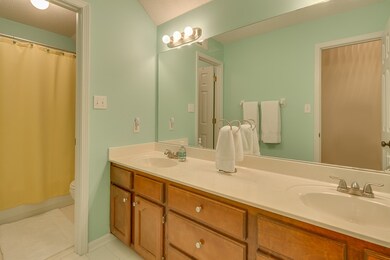 Double sinks and tile floors in the upstairs hall 