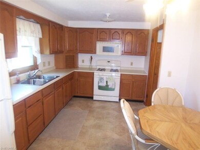 Eat-in kitchen with newer oak cabinets and newer v
