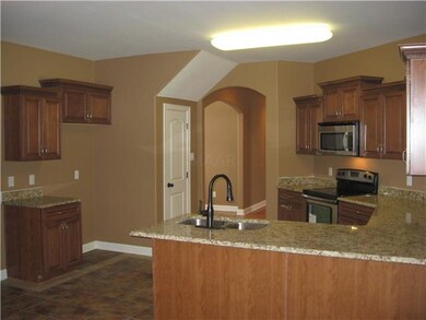 The kitchen has plenty of cabinet space, and the b